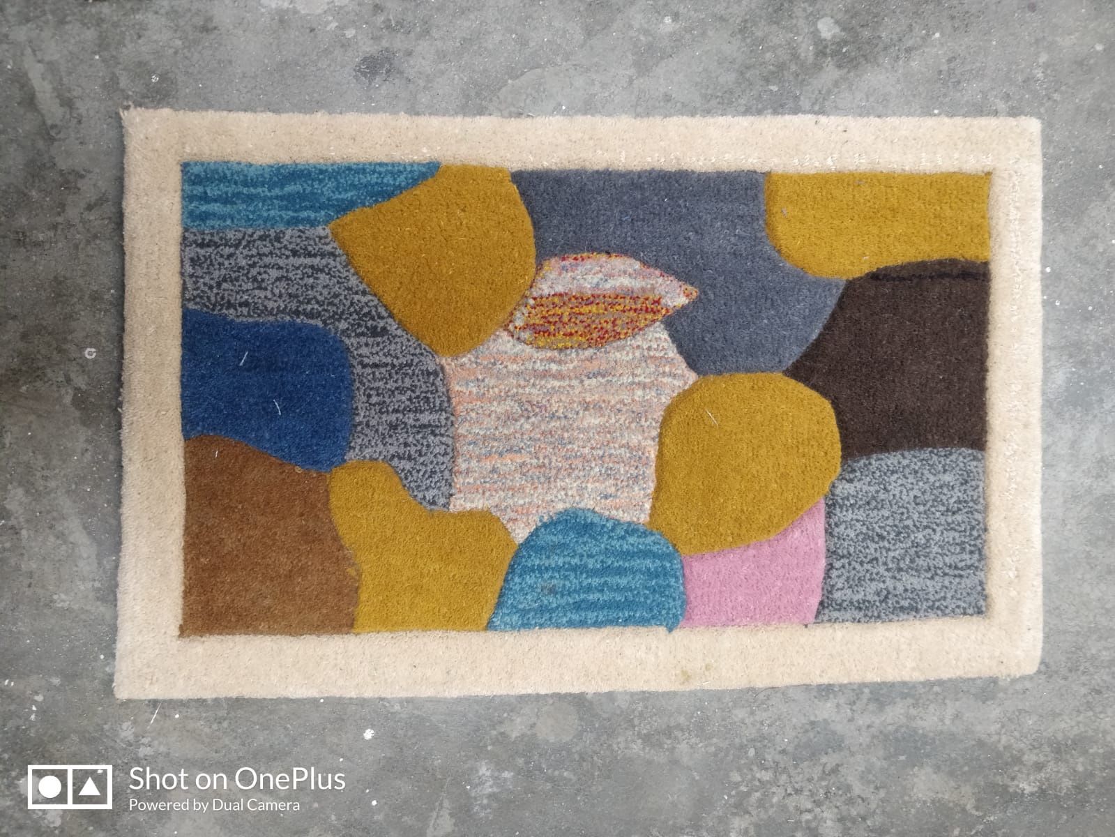 hand-tufted woolen rug or doormat